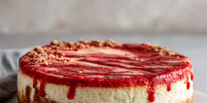 Delicious Strawberry Red Velvet Cheesecake topped with fresh strawberries