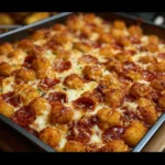 Delicious comfort food casserole topped with cheese and herbs.