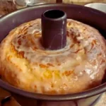 Delicious pineapple juice cake topped with fresh pineapple slices and cream