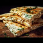 Delicious cheesy quesadilla with fresh toppings served on a plate