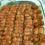 Plate of Bacon-Wrapped Smokies ready to serve as a delicious appetizer.