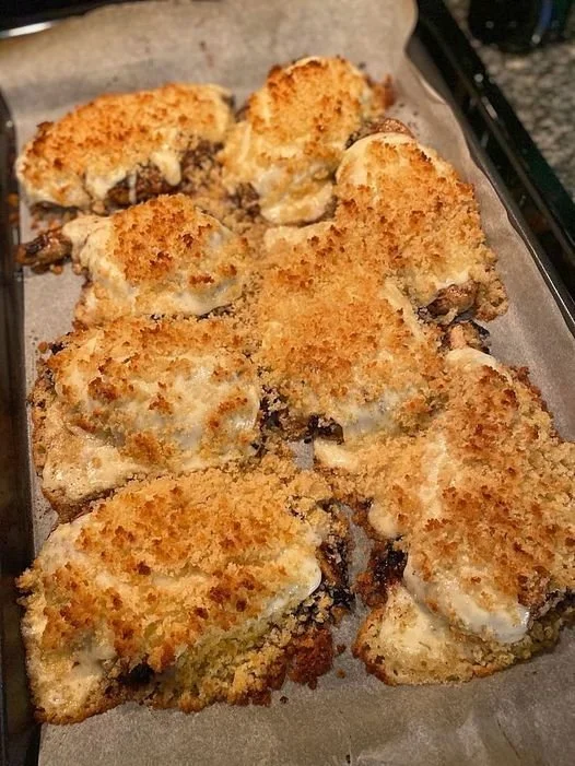 Baked chicken with Parmesan and mayo, golden and crispy on a plate.