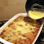 Delicious bread pudding served with creamy vanilla sauce