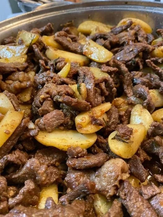 Delicious butter garlic steak bites served with roasted potatoes