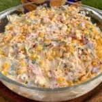 Delicious Cheesy Corn Bake with melted cheese and corn in a dish