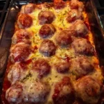 Cheesy Meatball Pasta Bake with melted cheese and flavorful meatballs