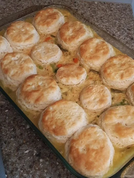 Hearty Chicken Biscuit Casserole topped with golden-brown biscuits and creamy chicken filling