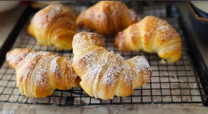 Freshly baked Italian Croissants on a wooden table