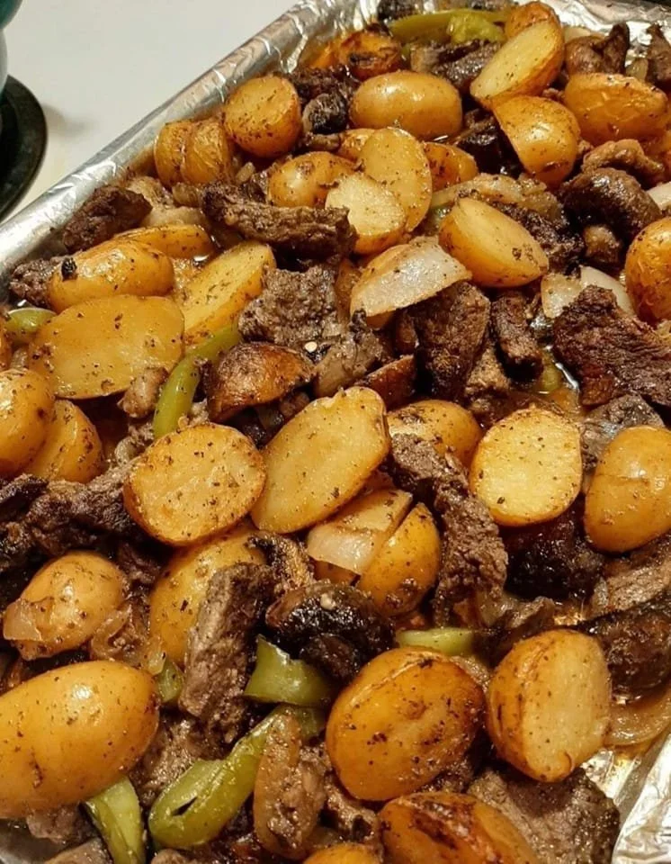 Delicious NY Strip Steak served with baby golden potatoes on a plate.