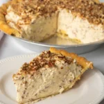 Delicious pecan cream pie with a creamy filling and crunchy pecans on top