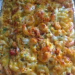 Delicious Seafood Macaroni and Cheese with shrimp and crab topping.
