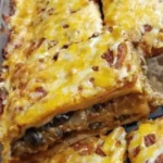 Delicious Taco Bake topped with cheese and fresh ingredients ready to serve