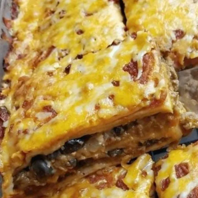 Delicious Taco Bake topped with cheese and fresh ingredients ready to serve