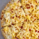Delicious Mac and Cheese Pizza topped with creamy macaroni and gooey cheese