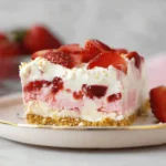 Delicious No-Bake Strawberry Delight dessert layered with fresh strawberries