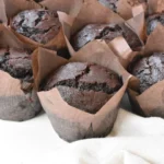 Delicious bakery style double chocolate chip muffins fresh out of the oven