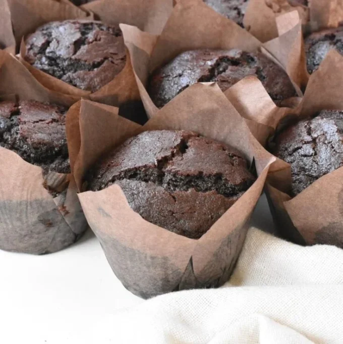 Delicious bakery style double chocolate chip muffins fresh out of the oven
