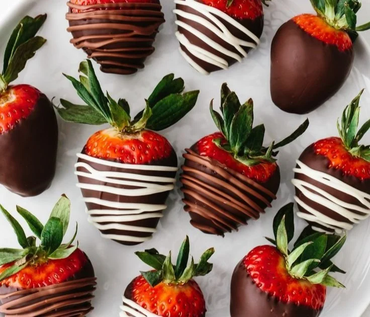 Delicious chocolate covered strawberries arranged on a platter.