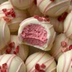 Creamy strawberry white chocolate truffles topped with fresh strawberries