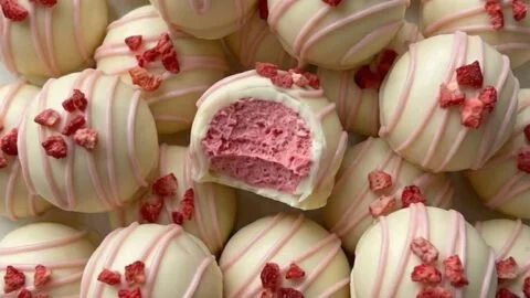 Creamy strawberry white chocolate truffles topped with fresh strawberries