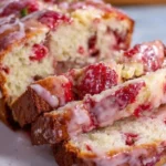Delicious glazed strawberry bread with a sweet topping ready to be enjoyed.