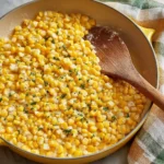 Honey butter skillet corn served in a cast iron pan, featuring a sweet glaze