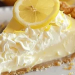 No-Bake Cream Cheese Lemonade Pie topped with fresh lemons and whipped cream