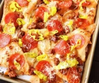 Plate of Old Chicago's Italian Nachos topped with herbs and cheese