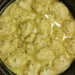 Feather dumplings in a bowl of chicken and dumplings