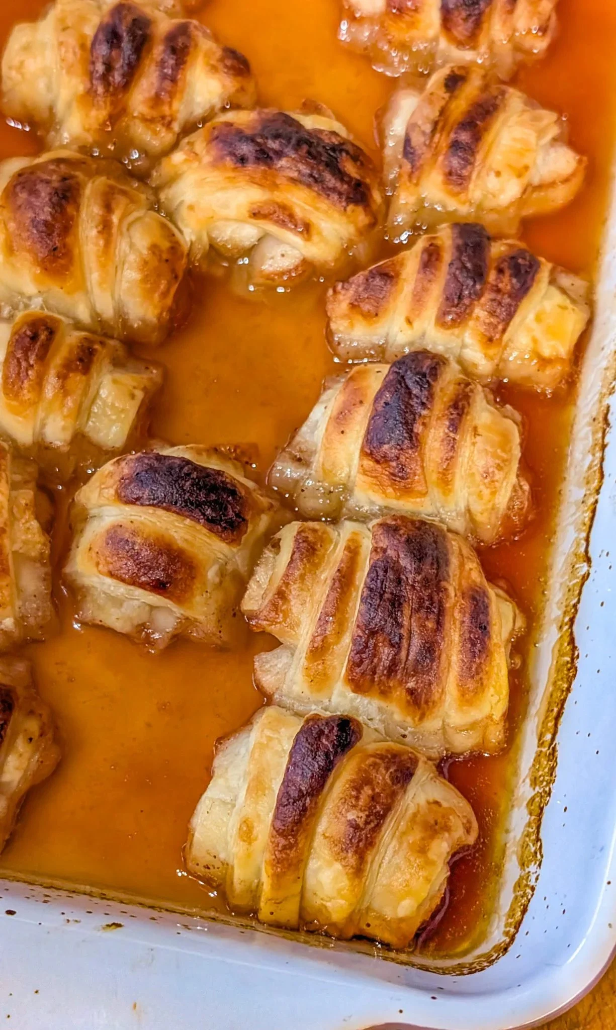 Grandma's delicious apple dumplings served with cinnamon and vanilla sauce
