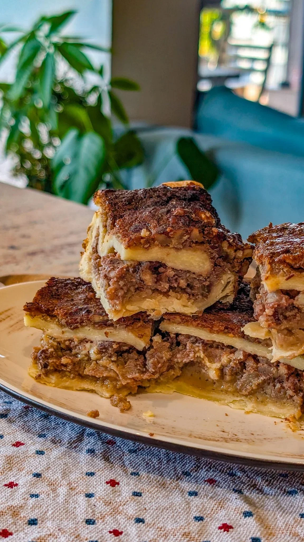 Pecan Pie-Style Cobbler topped with pecans and caramel sauce