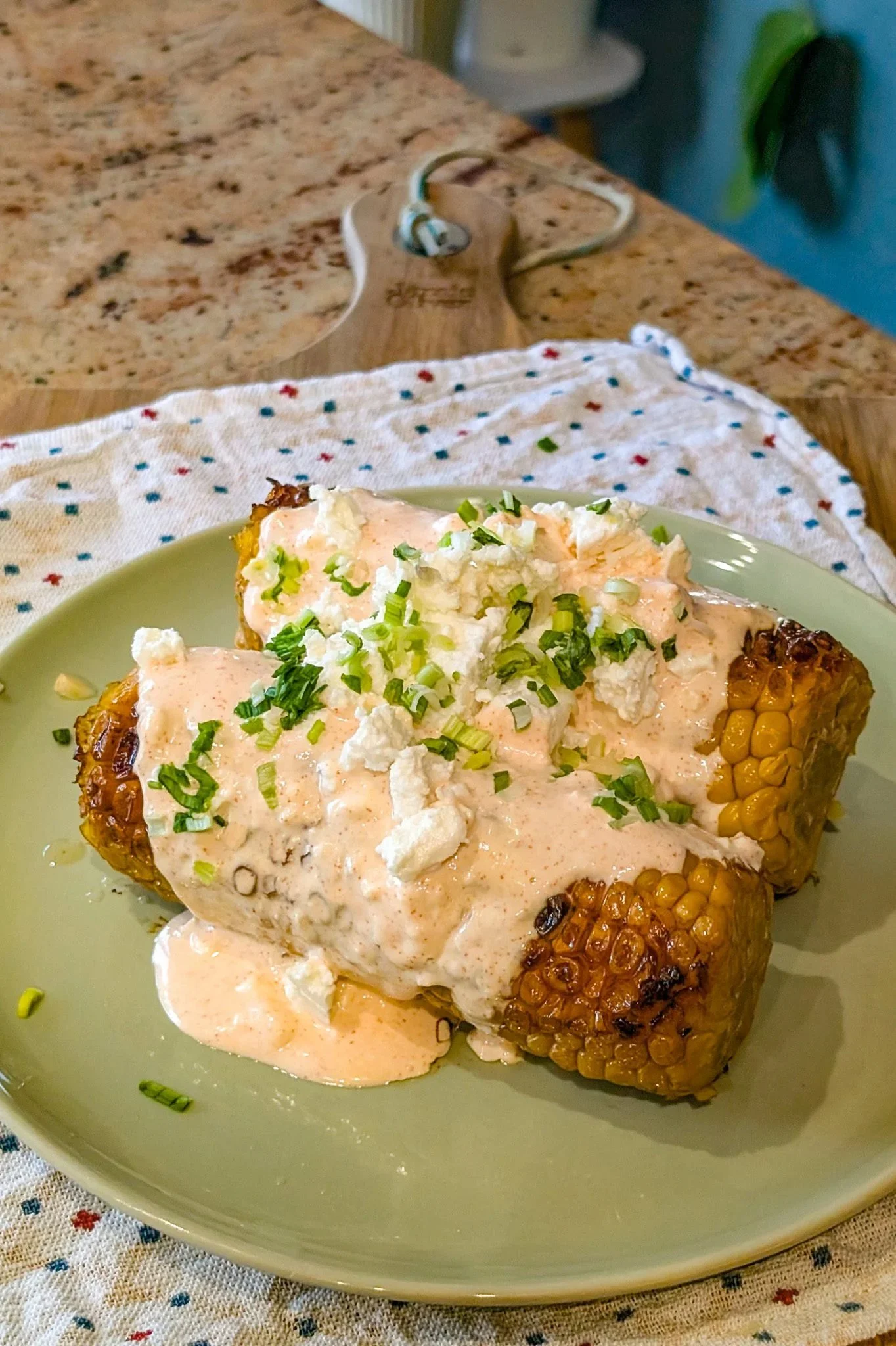 Deliciously grilled Mexican street corn topped with cheese and spices