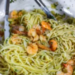 Spaghetti with Garlic Butter Shrimp served in a bowl, garnished with parsley.