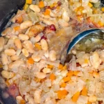 Delicious beans with ham hocks served in a bowl, showcasing a hearty meal.