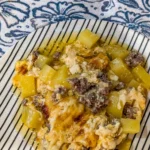 Delicious cheesy hamburger potato casserole served in a baking dish