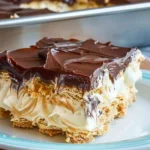 Decadent chocolate eclair cake with creamy layers and rich chocolate frosting.
