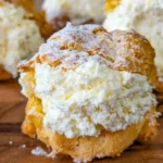 Deliciously filled dreamy cream puffs on a serving plate