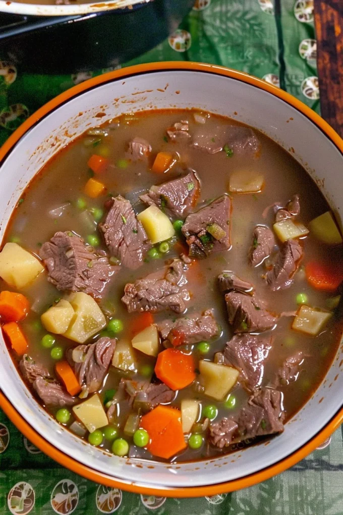 Bowl of easy beef stew with vegetables and herbs