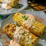 Delicious Mexican street corn topped with cheese and spices