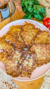 Homemade German potato pancakes served with applesauce and sour cream