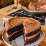 Grandma's delicious homemade chocolate cake topped with creamy frosting.