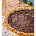 Delicious slice of Grandma's Cocoa Cream Pie with whipped cream topping