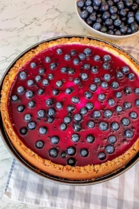 Delicious fresh blueberry cheesecake topped with juicy blueberries