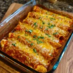 Creamy cottage cheese chicken enchiladas served on a plate with toppings.