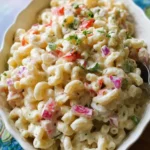 Bowl of easy macaroni salad with vegetables and dressing