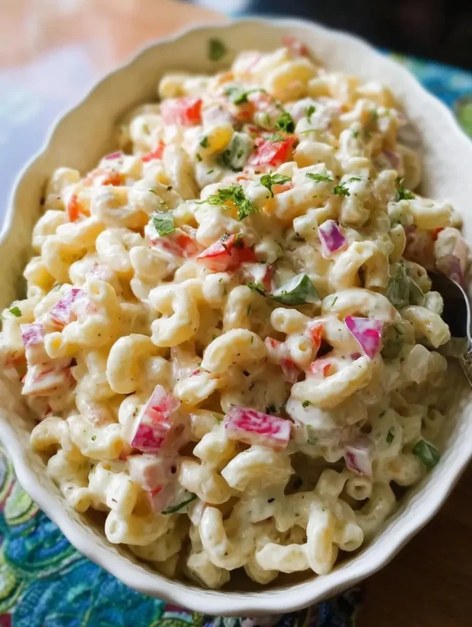 Bowl of easy macaroni salad with vegetables and dressing