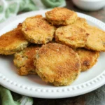 Delicious plate of crispy fried green tomatoes served in a restaurant.