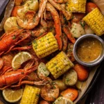 Delicious garlic-butter Cajun seafood boil with shrimp, crab, and corn