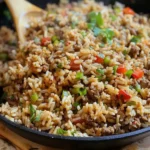 Bowl of Louisiana-style dirty rice with ground meat and spices
