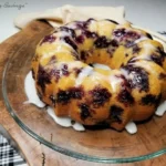 Freshly baked Blueberry Sour Cream Pound Cake with blueberries on top